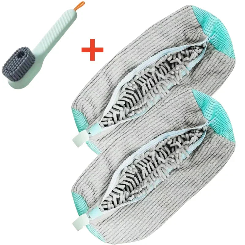 Two gray cleaning brushes with teal accents and a scrubber on a white background
