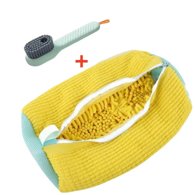 Yellow scrubber with bristles and a green handle on a white background