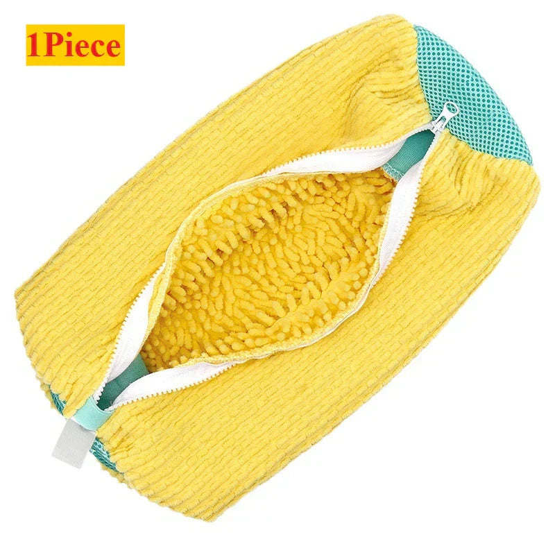 Yellow cleaning pad with a textured surface on a white background