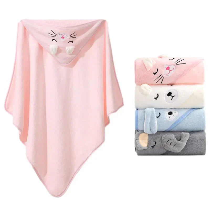 Set of baby blankets with cartoon faces, including pink, white, blue, and gray ones.